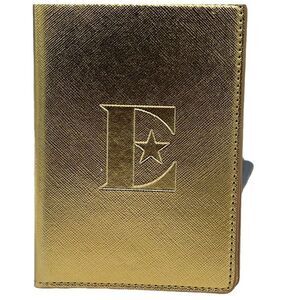 Vintage Elton John gold colored passport cover.